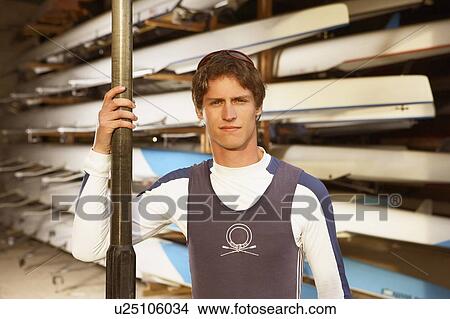 Oarsman outside boat shed. View Large Photo Image Picture - Oarsman outside boat shed.. Fotosearch