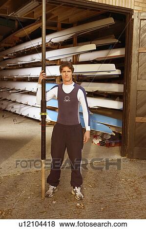 Oarsman outside boat shed. View Large Photo Image Stock Photo - Oarsman outside boat shed.. Fotosearch