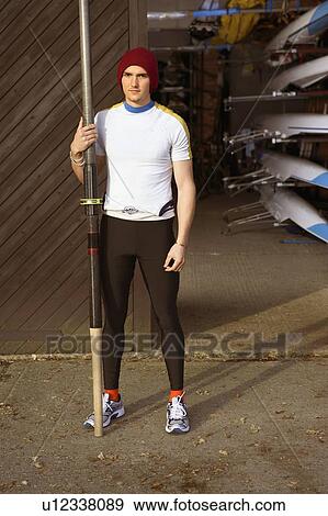 Oarsman outside boat shed. View Large Photo Image Stock Photo - Oarsman outside boat shed.. Fotosearch