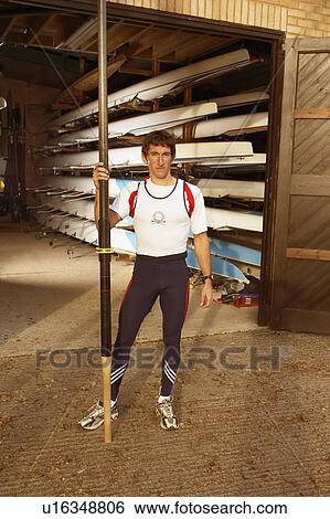 Oarsman outside boat shed. View Large Photo Image Stock Photograph - Oarsman outside boat shed.. Fotosearch