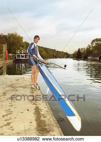 Skuller lowering skull onto river. View Large Photo Image Stock Image - Skuller lowering skull onto river.. Fotosearch