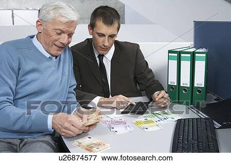 Stock Photo - Colleagues counting money. Fotosearch