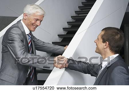 Stock Image - Colleagues on stairs. Fotosearch