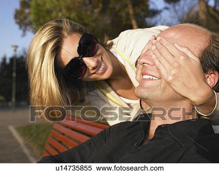 Couple smiling, outdoors View Large Photo Image Stock Photography - Couple smiling, outdoors. Fotosearch