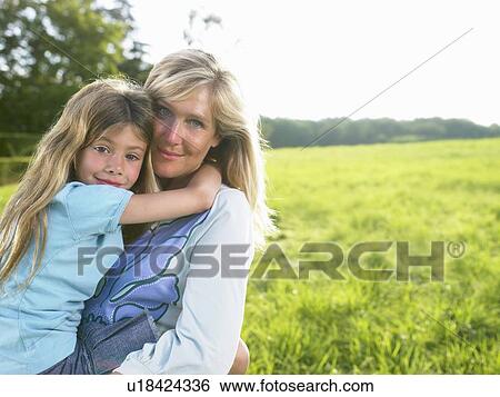 Stock Photograph - Mother and daughter portrait.. Fotosearch