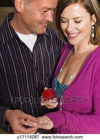 Woman admiring her engagement ring View Large Photo Image Stock Photo - Woman admiring her engagement ring. Fotosearch