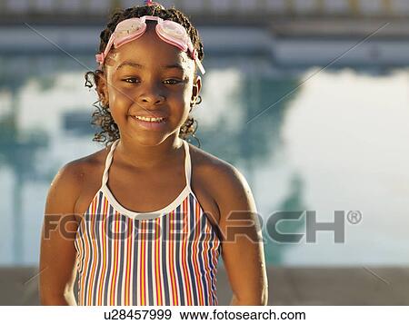 Young girl in swimming costume (portrait) View Large Photo Image Stock Photo - Young girl in swimming costume (portrait). Fotosearch