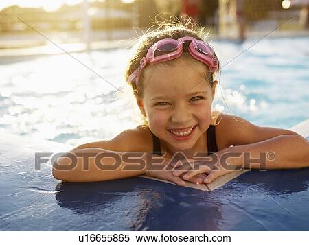 Young girl in swimming pool (portrait) View Large Photo Image Stock Photography - Young girl in swimming pool (portrait). Fotosearch