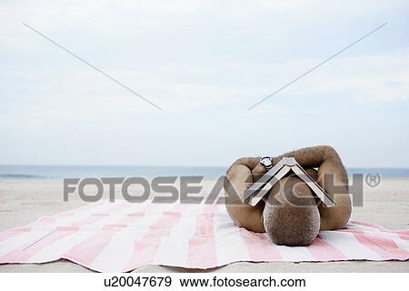 Man sleeping on beach with book on his face View Large Photo Image Stock Photo - Man sleeping on beach with book on his face. Fotosearch