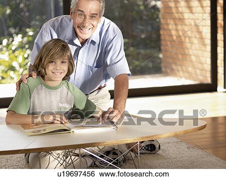 Grandfather and grandson reading book (portrait) View Large Photo Image Stock Photograph - Grandfather and grandson reading book (portrait). Fotosearch