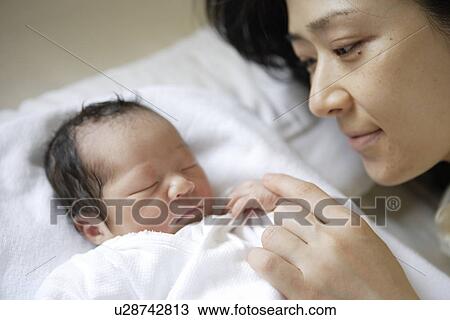 Stock Image - The Baby And Mother Who Sleep. Fotosearch