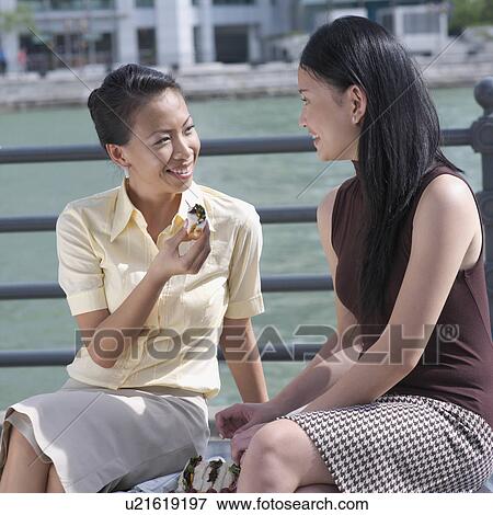 Two businesswomen looking at each other View Large Photo Image Stock Photo - Two businesswomen looking at each other. Fotosearch