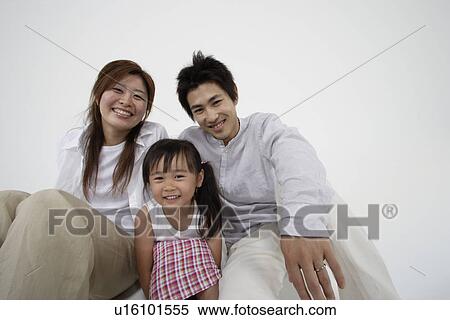 Stock Photography - A young couple with a girl. Fotosearch