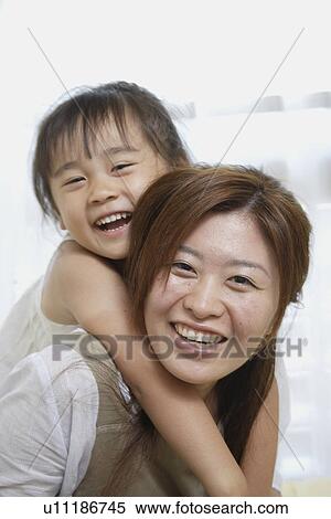 A young mother with a daughter View Large Photo Image Stock Photography - A young mother with a daughter. Fotosearch