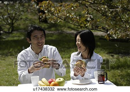 A couple having breakfast in garden View Large Photo Image Stock Image - A couple having breakfast in garden. Fotosearch
