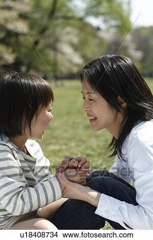 Mother and daughter playing in garden View Large Photo Image Picture - Mother and daughter playing in garden. Fotosearch