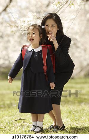 Mother and daughter smiling View Large Photo Image Picture - Mother and daughter smiling. Fotosearch