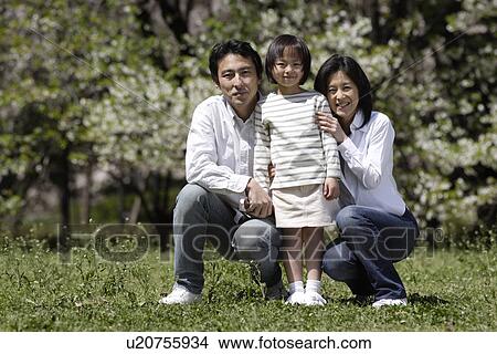 Picture - Portrait of a family posing in together. Fotosearch