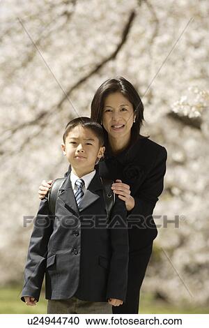 Stock Image - Portrait of mother and son smiling. Fotosearch