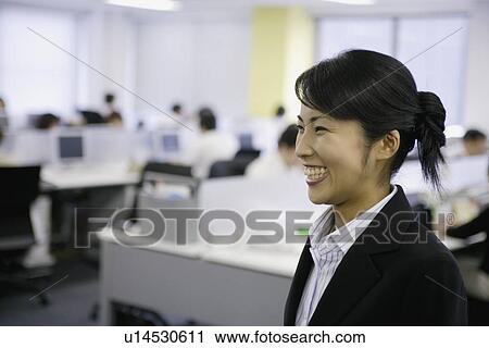 A ecstatic view of woman in the office View Large Photo Image Stock Image - A ecstatic view of woman in the office. Fotosearch