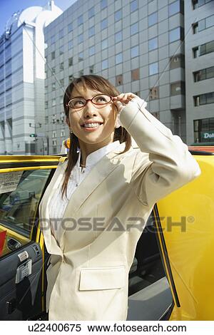 Stock Photography - Woman near a car, portrait. Fotosearch