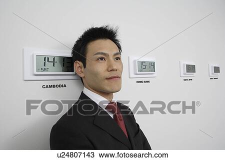 Businessman with time zones, portrait View Large Photo Image Stock Image - Businessman with time zones, portrait. Fotosearch