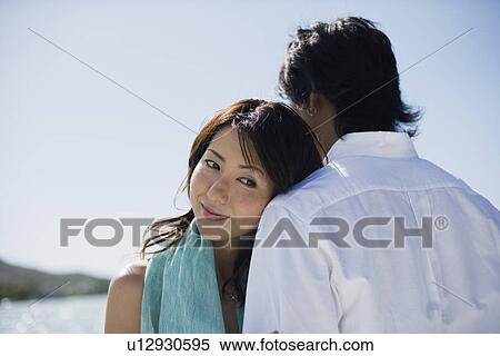 A young couple embracing each other View Large Photo Image Stock Photography - A young couple embracing each other. Fotosearch