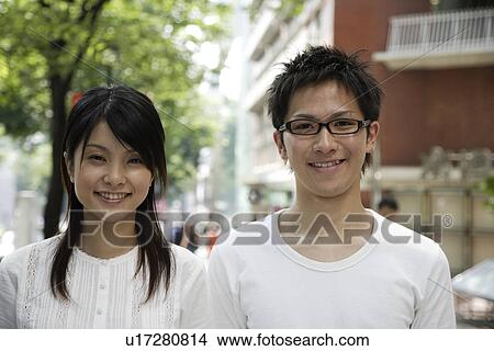 Picture - Portrait of a young couple smiling. Fotosearch