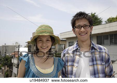 Portrait of a young couple smiling View Large Photo Image Stock Photo - Portrait of a young couple smiling. Fotosearch