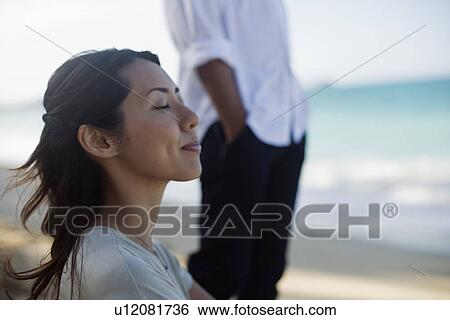 Profile of a young woman with eyes closed View Large Photo Image Stock Photograph - Profile of a young woman with eyes closed. Fotosearch