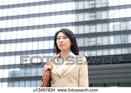 A young businesswoman walking View Large Photo Image Picture - A young businesswoman walking. Fotosearch