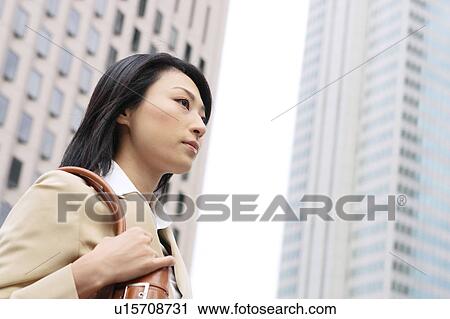 A young businesswoman walking View Large Photo Image Stock Image - A young businesswoman walking. Fotosearch