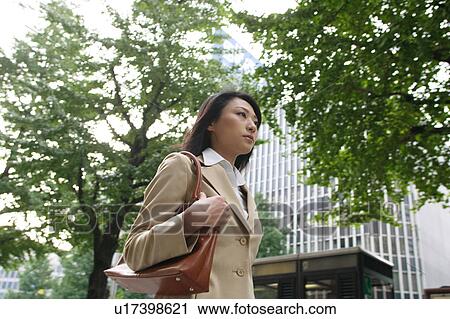 Stock Image - A young businesswoman walking. Fotosearch