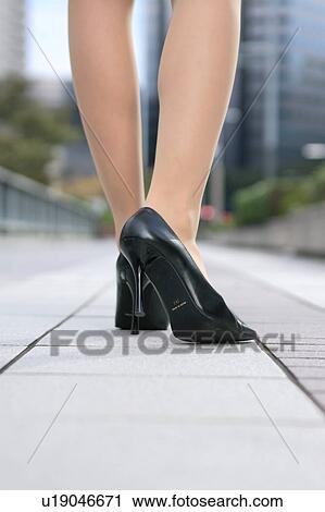 Stock Image - A young woman's legs, close-up. Fotosearch