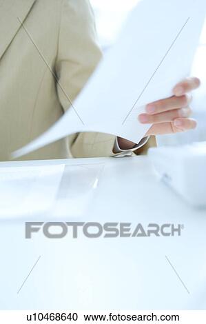 Close up of a young woman working in office View Large Photo Image Stock Image - Close up of a young woman working in office. Fotosearch