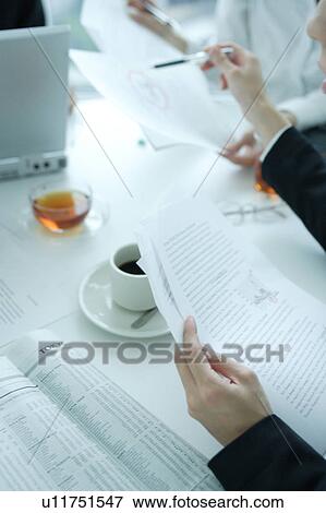 Small group of young women having meeting in office View Large Photo Image Stock Photo - Small group of young women having meeting in office. Fotosearch