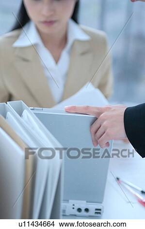 Two young women working in office View Large Photo Image Picture - Two young women working in office. Fotosearch