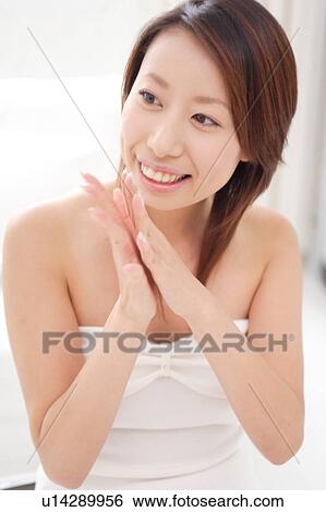 Stock Photograph - A young woman anticipating something. Fotosearch