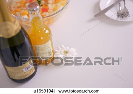 Stock Image - Champagne and orange juice. Fotosearch