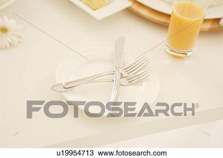 Stock Image - Cutlery at table. Fotosearch