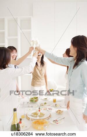 Five young women toasting with glasses of champagne View Large Photo Image Picture - Five young women toasting with glasses of champagne. Fotosearch