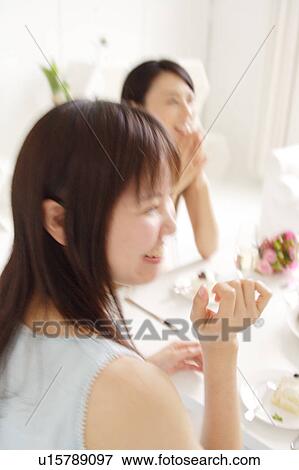 Small group of people having home party View Large Photo Image Stock Photo - Small group of people having home party. Fotosearch