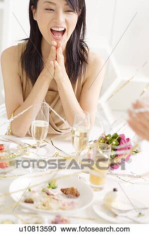 Stock Image - Small group of young women celebrating. Fotosearch