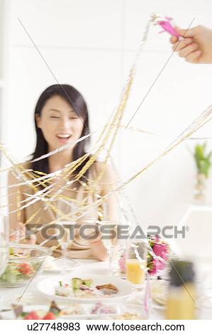 Stock Image - Small group of young women celebrating. Fotosearch