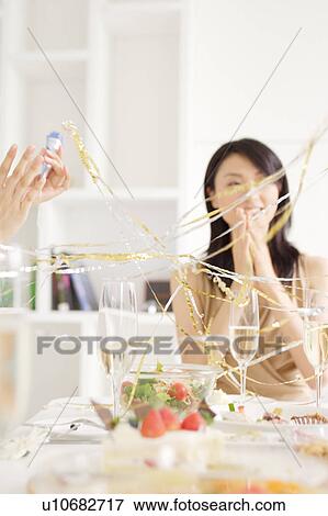 Small group of young women celebrating View Large Photo Image Stock Photo - Small group of young women celebrating. Fotosearch