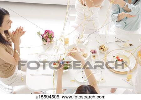 Small group of young women celebrating View Large Photo Image Stock Photograph - Small group of young women celebrating. Fotosearch