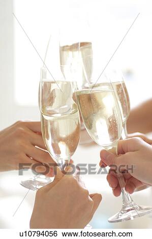 Toast with glasses of champagne, close-up View Large Photo Image Stock Photograph - Toast with glasses of champagne, close-up. Fotosearch