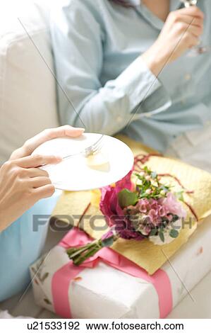 Stock Image - Two women enjoying party at home. Fotosearch