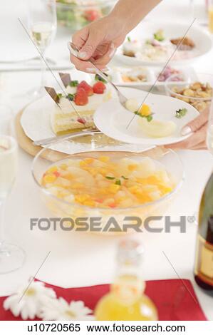 Woman's had serving fruit, close-up View Large Photo Image Stock Photography - Woman's had serving fruit, close-up. Fotosearch