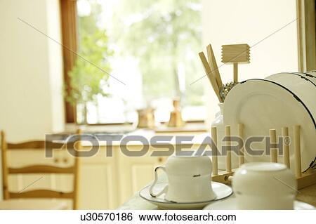 Dish rack in kitchen View Large Photo Image Stock Photograph - Dish rack in kitchen. Fotosearch